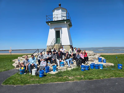 Bowling Green State University football player Beau Carmon joins Port Clinton Middle School to pick up litter at Port Clinton City Beach, Ohio. Photo credit: Eriesponsible.