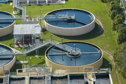Aerial view of water treatment factory at city wastewater cleaning facility. Purification process of removing undesirable chemicals, suspended solids and gases from contaminated liquid