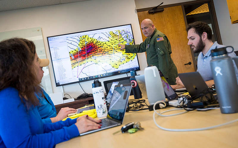 Storm data being reviewed on a large monitor in an office. | Photo by Scripps Institute of Oceanography
