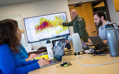 Storm data being reviewed on a large monitor in an office. | Photo by Scripps Institute of Oceanography