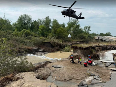 Black Hawk helicopters dropped sand bags into the river to create a second barrier. | Photo by the city of Carmel